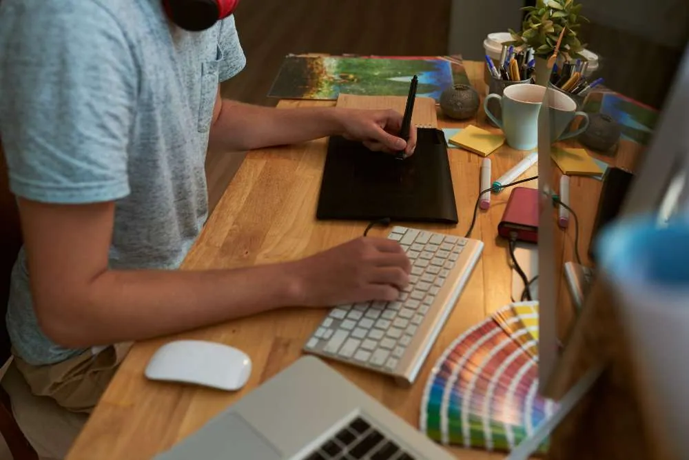 Person drawing branding concepts on a computer - branding and consulting in UAE